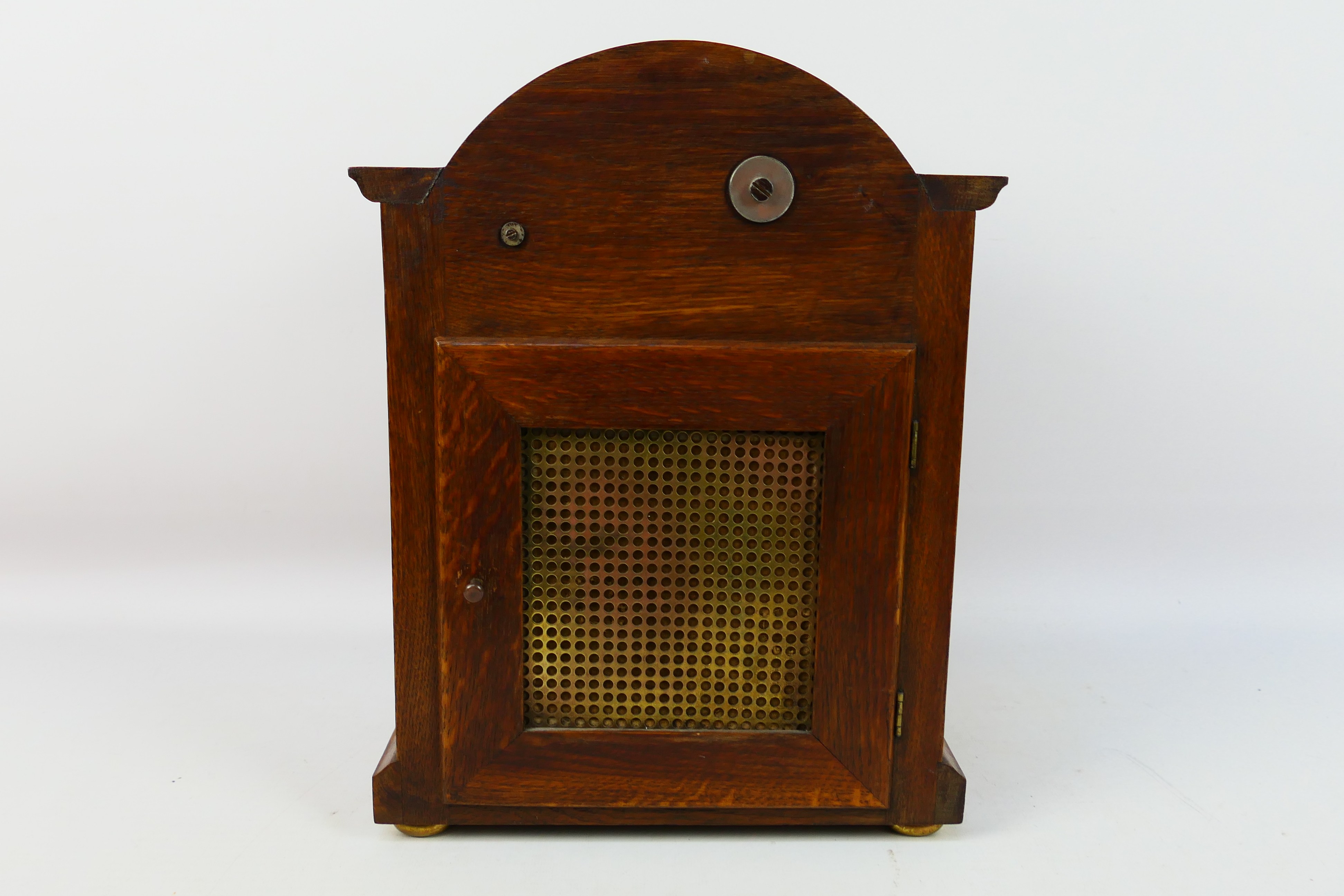 An early 20th century oak cased Westminster chiming mantel clock, the case of a medium oak colour, - Image 7 of 9