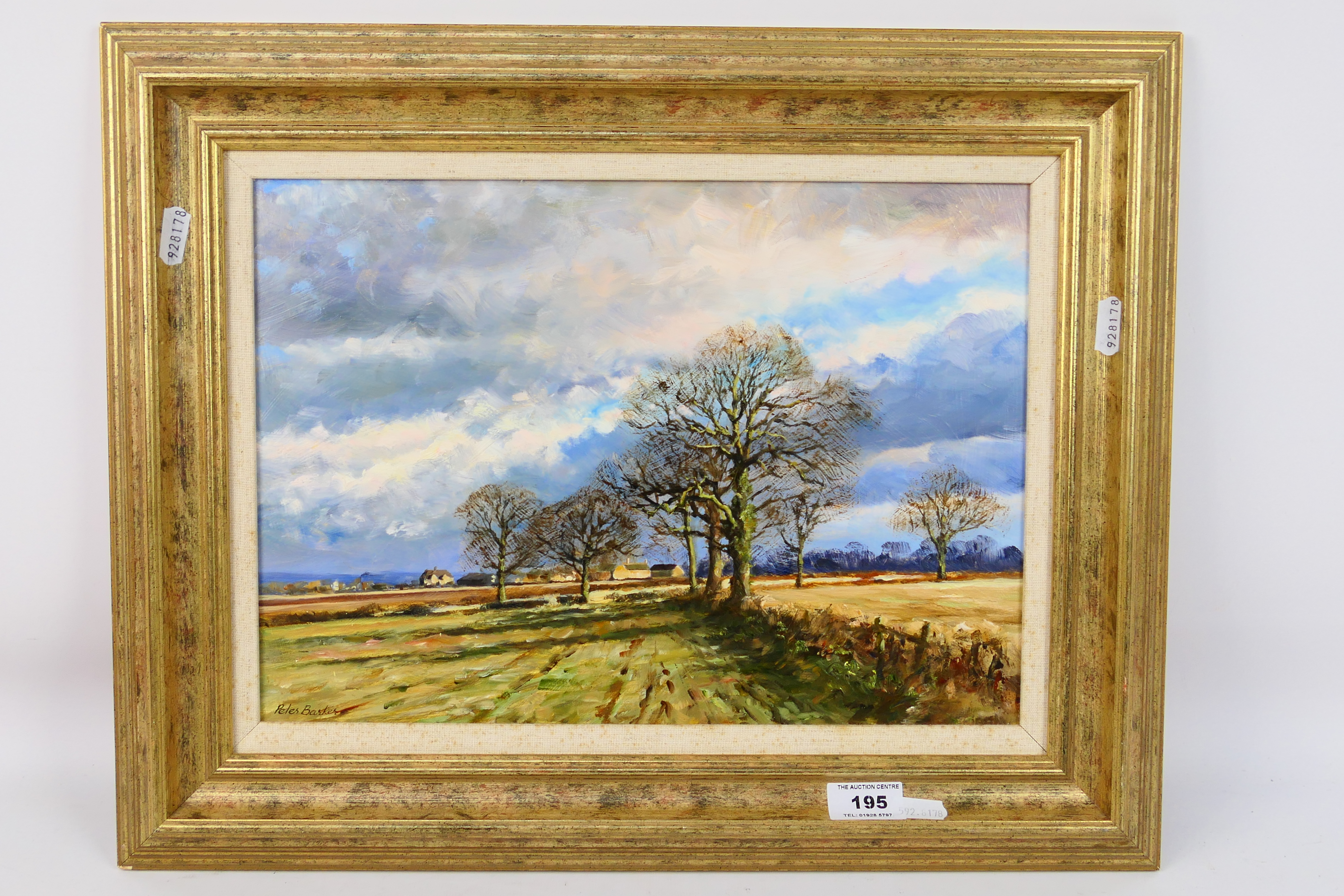 Peter Barker RSMA - A framed oil on board landscape scene, titled verso Blustery Day,