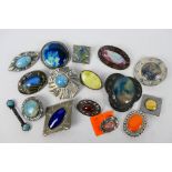 A good collection of Ruskin style brooches.