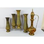 Lot to include four large brass vases with chased decoration,