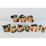 A collection of Royal Doulton character jugs to include Robin Hood, Pied Piper, The Trapper,