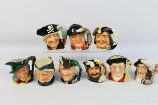 A collection of Royal Doulton character jugs to include Robin Hood, Pied Piper, The Trapper,
