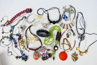 A collection of costume jewellery comprising necklaces and bracelets.