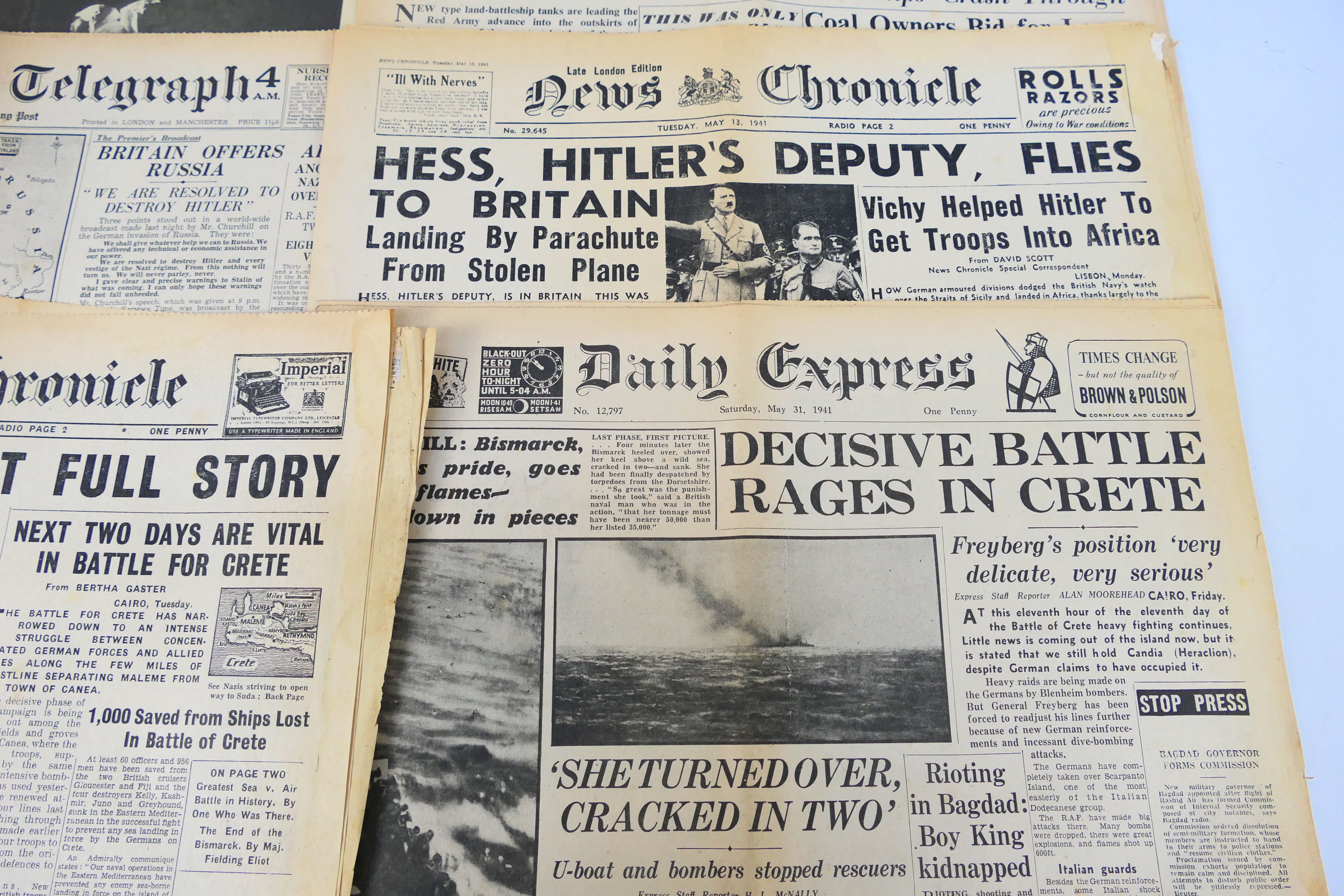 A collection of vintage newspapers with front pages detailing historically significant events to - Image 5 of 6