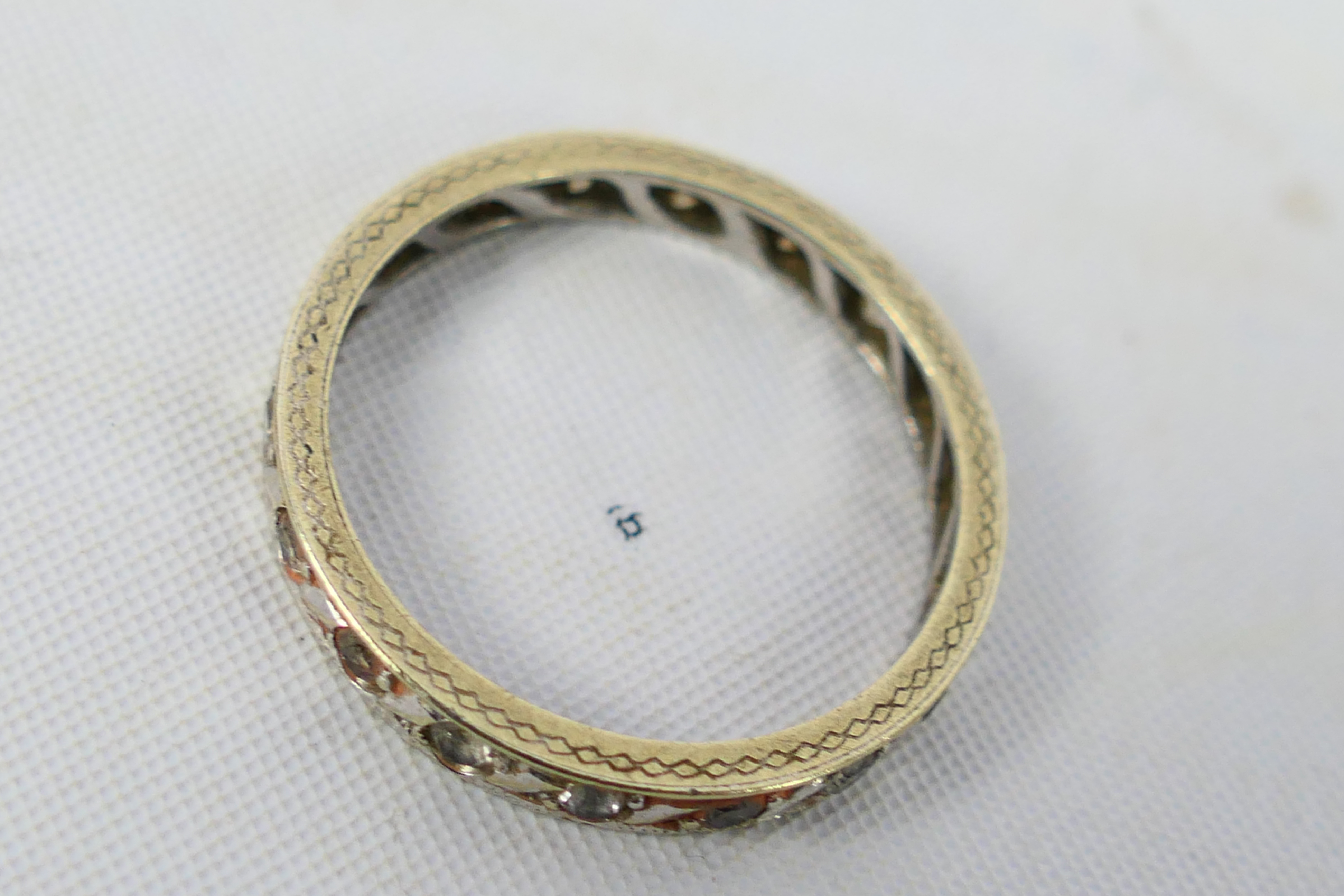 A white metal, diamond set eternity ring, marks quite rubbed but appears to be stamped 9ct, - Image 3 of 3