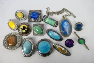 A good collection of Ruskin style brooches and a pendant.