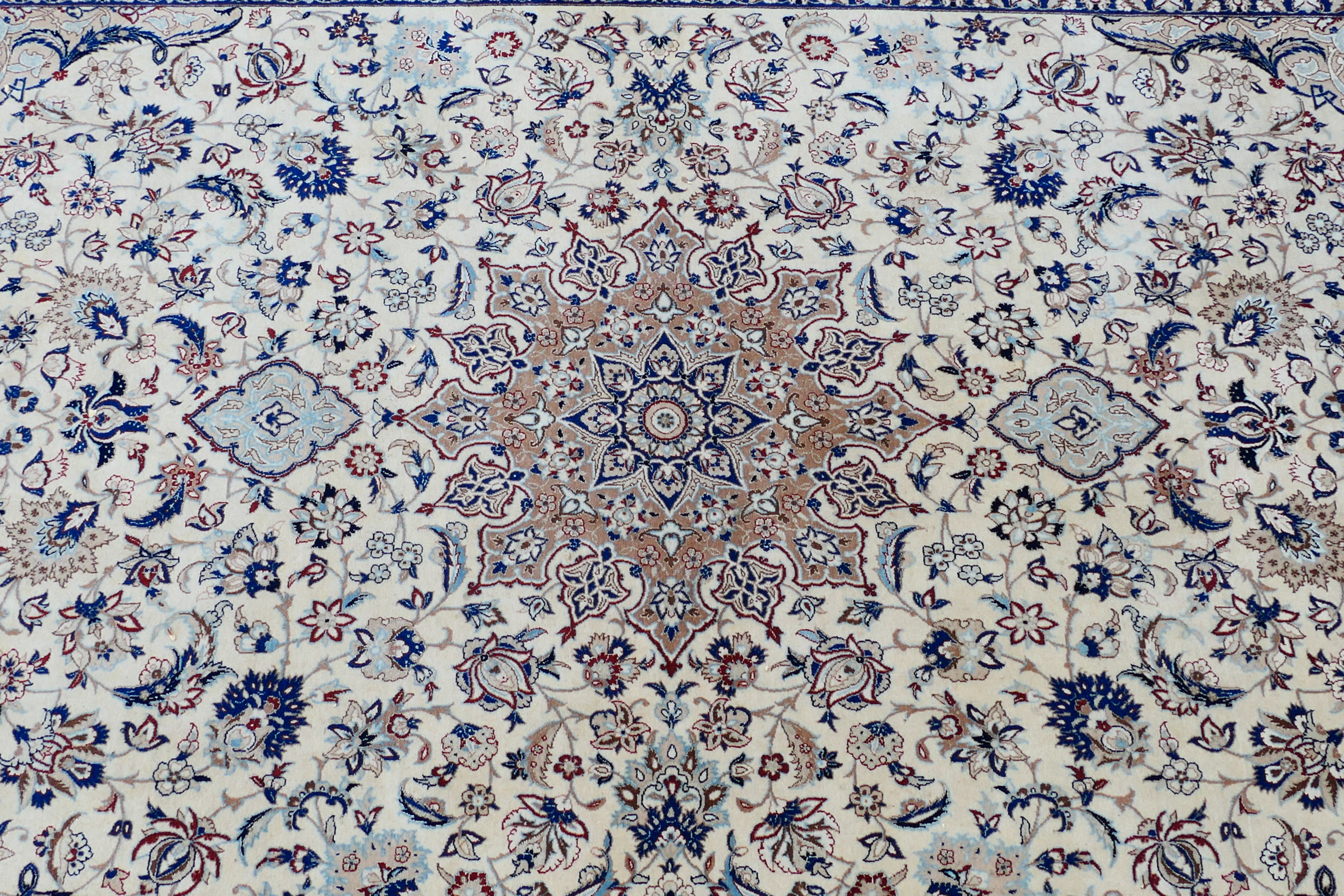 A Persian ivory ground rug with central medallion on a floral field, with foliage scroll border, - Image 3 of 14