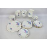 A quantity of floral decorated tea wares, retailed by Lawleys of Regent Street,