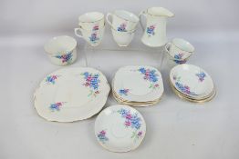 A quantity of floral decorated tea wares, retailed by Lawleys of Regent Street,