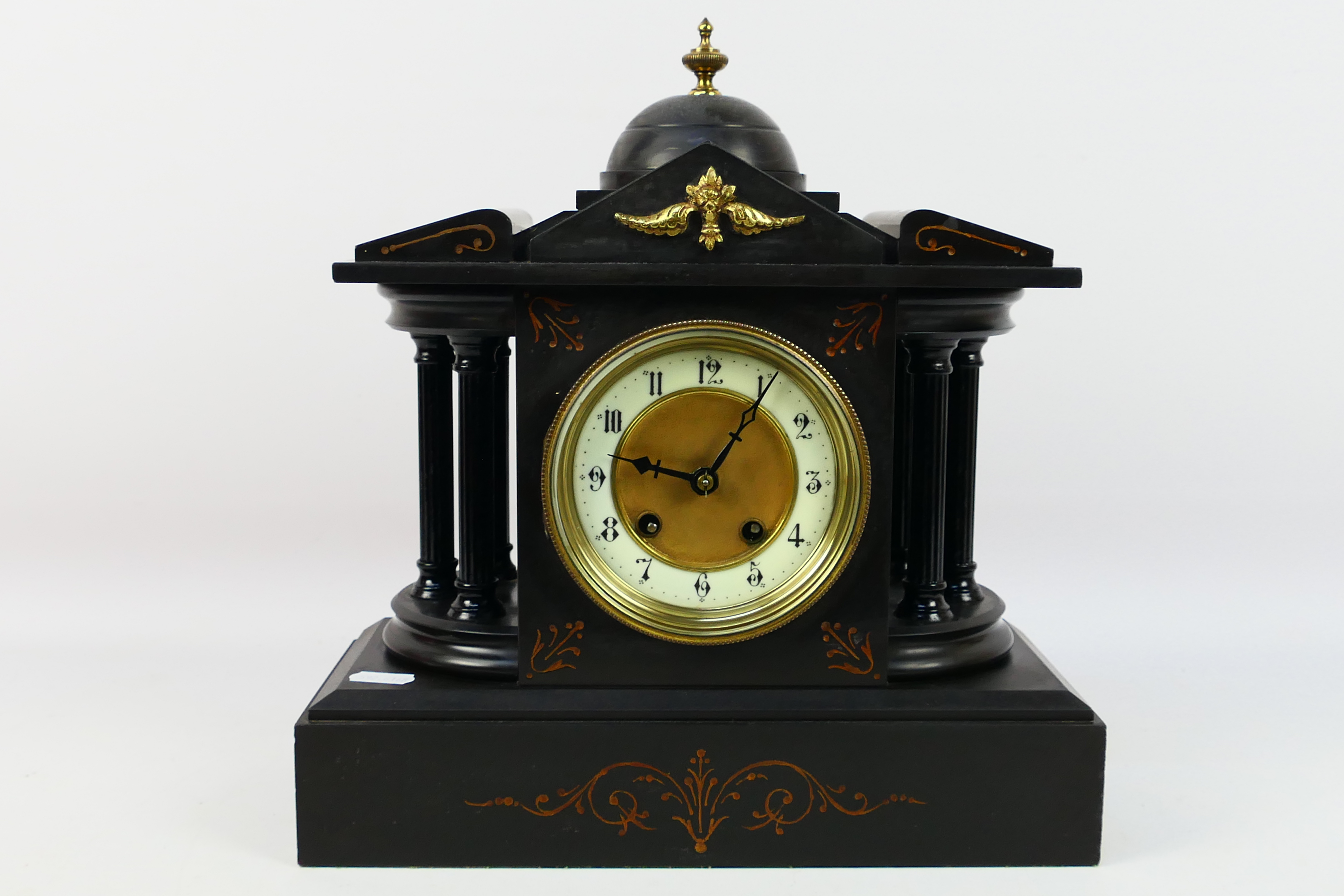 A mantel clock of architectural form, Arabic numerals to a 4" dial, approximately 32 cm (h),