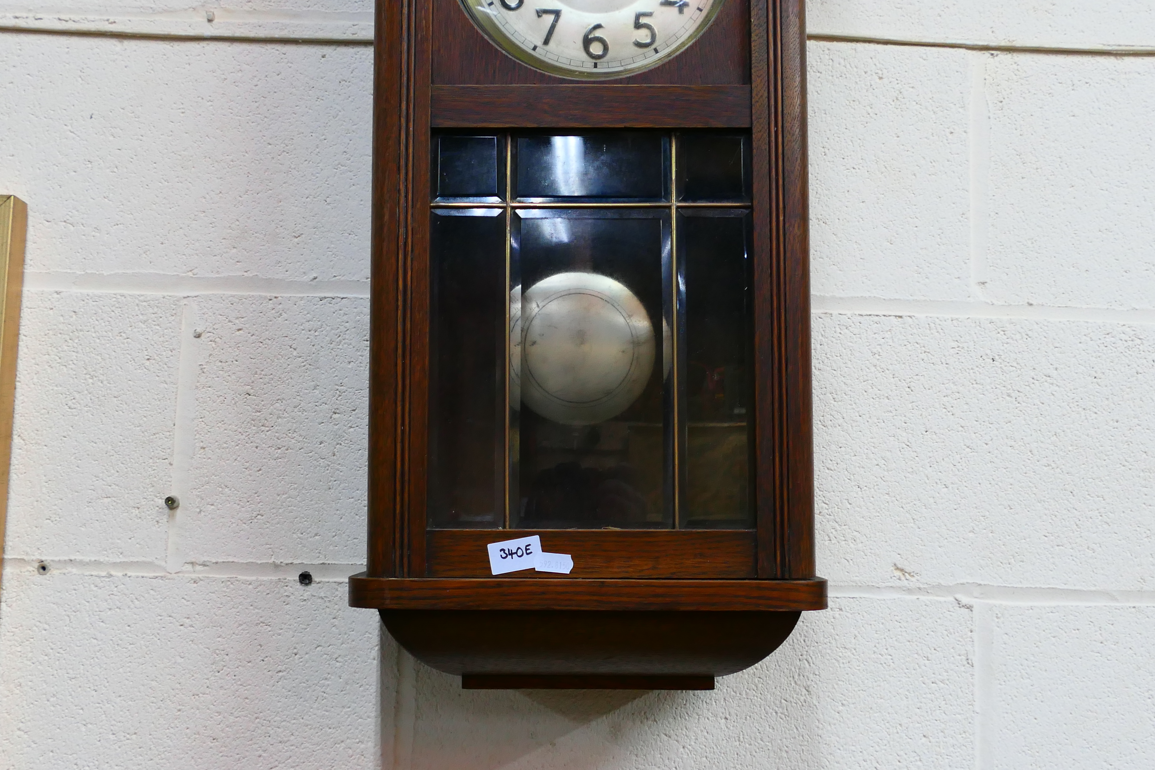 An oak cased wall clock, Arabic numerals to the dial, with pendulum. - Image 4 of 4