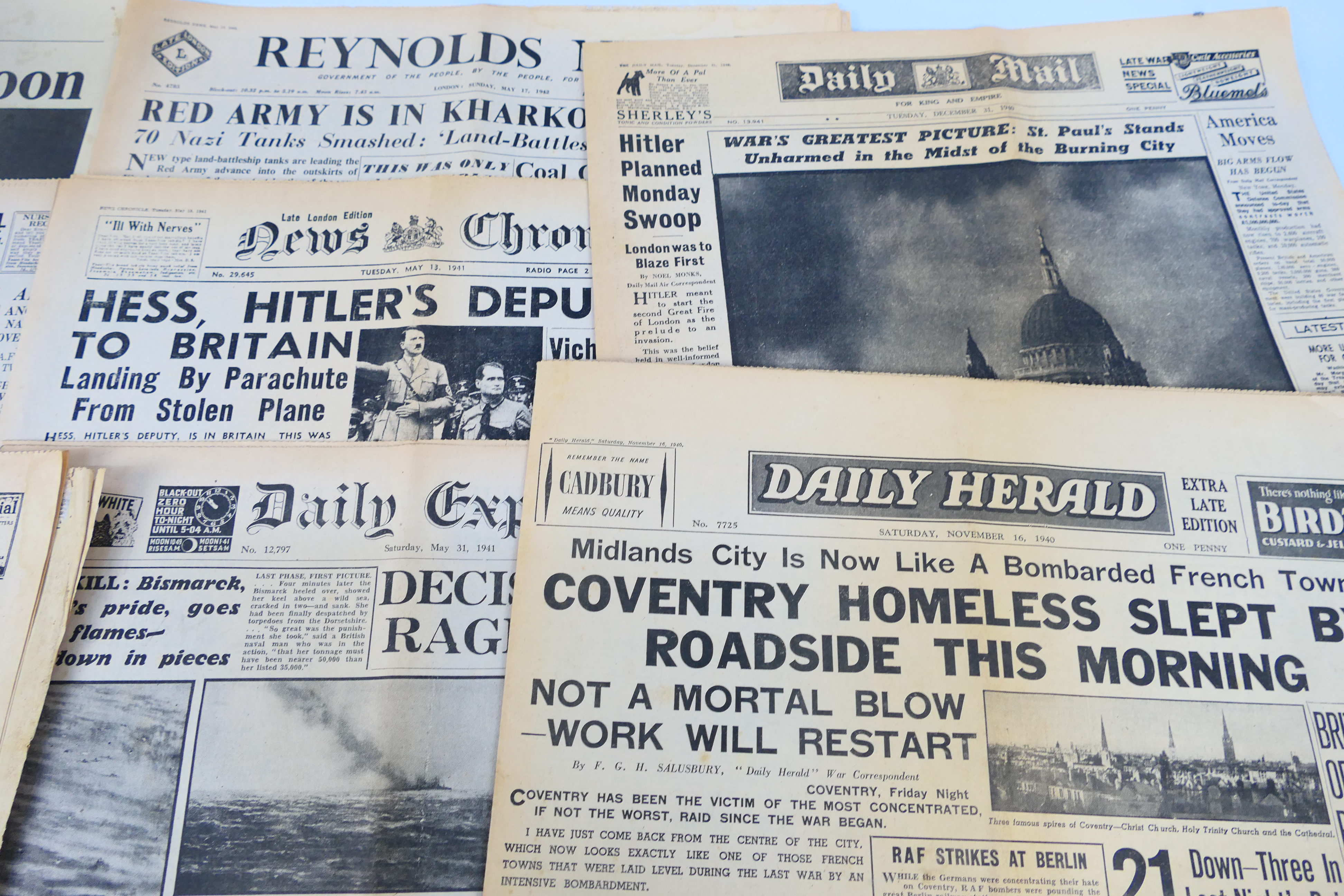 A collection of vintage newspapers with front pages detailing historically significant events to - Image 4 of 6
