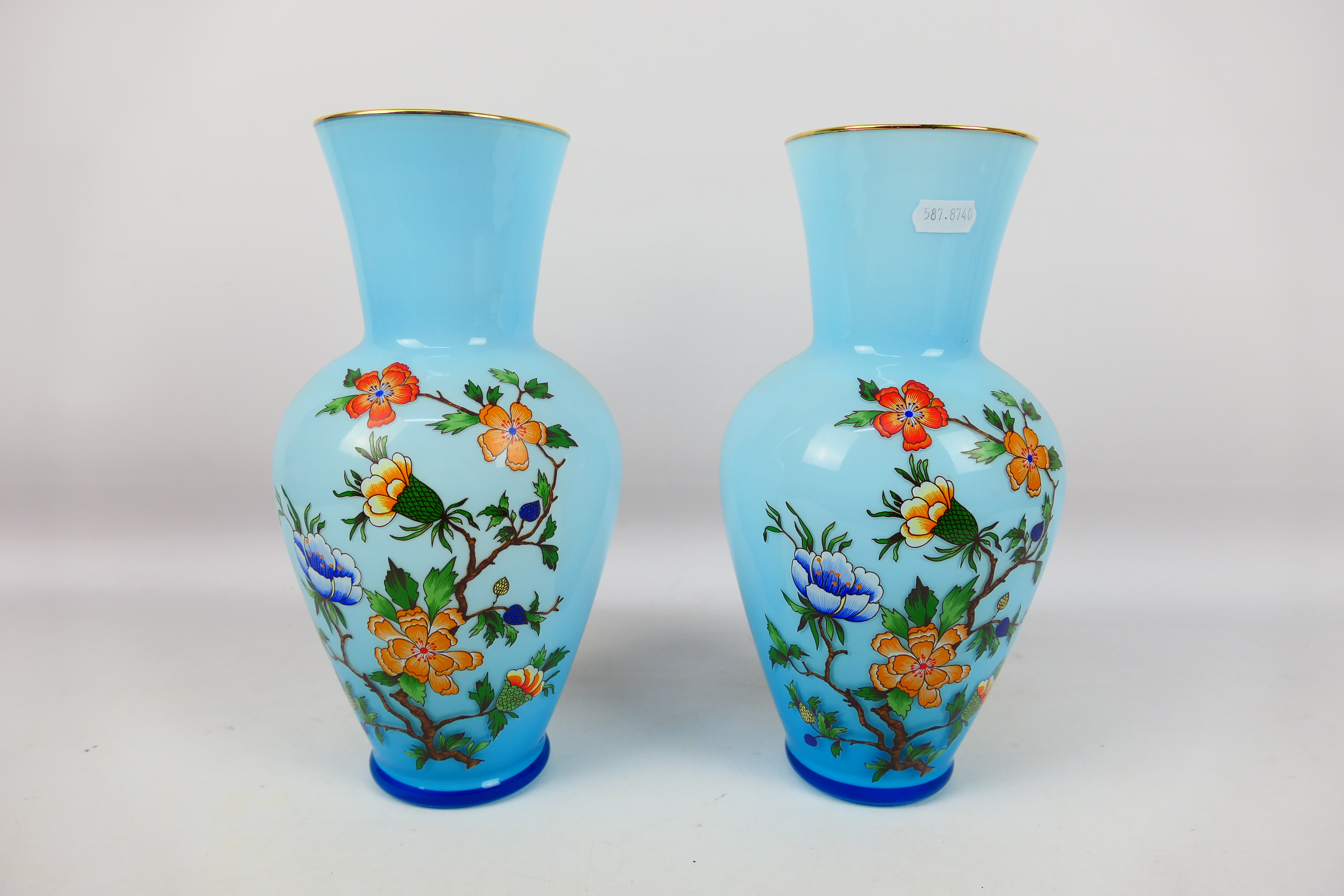 A pair of glass vases with floral decoration, approximately 28 cm (h). [2].