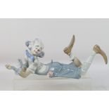 Lladro - A large figure depicting a recumbent clown with flowers, # 6913, The Magic Of Comedy,