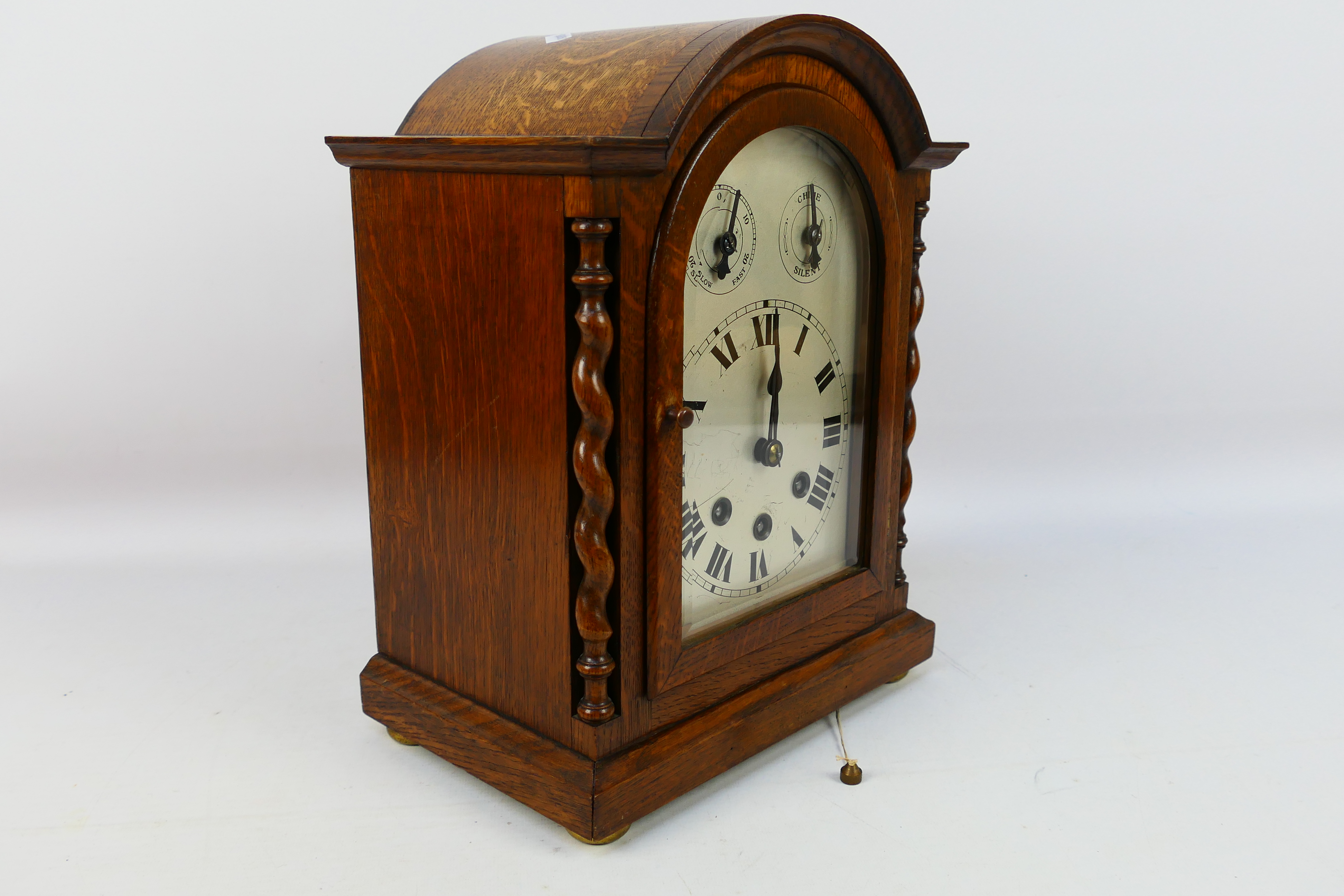 An early 20th century oak cased Westminster chiming mantel clock, the case of a medium oak colour, - Image 6 of 9