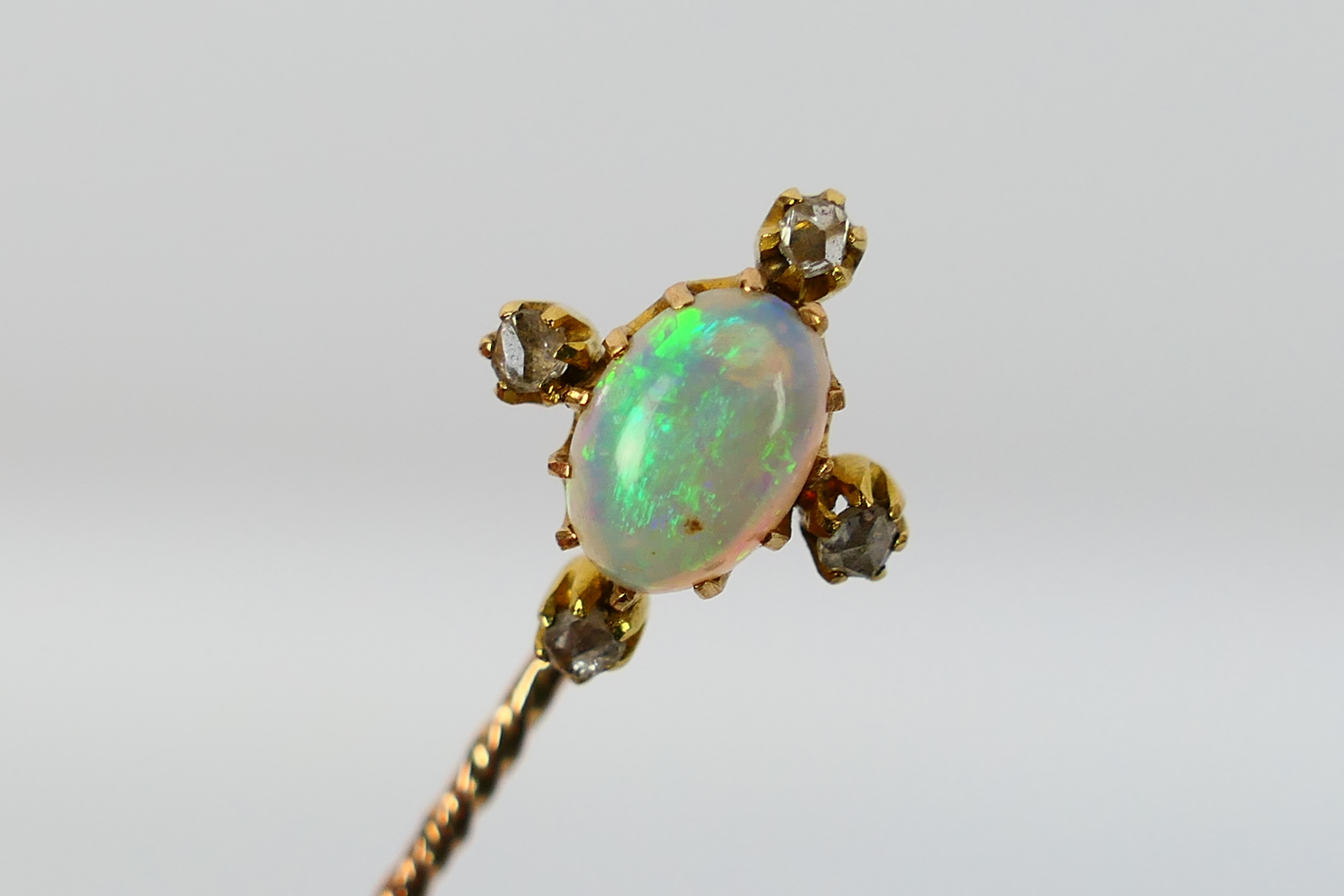 An Edwardian white opal and diamond stick pin contained in fitted case, 1.3 grams. - Image 2 of 4