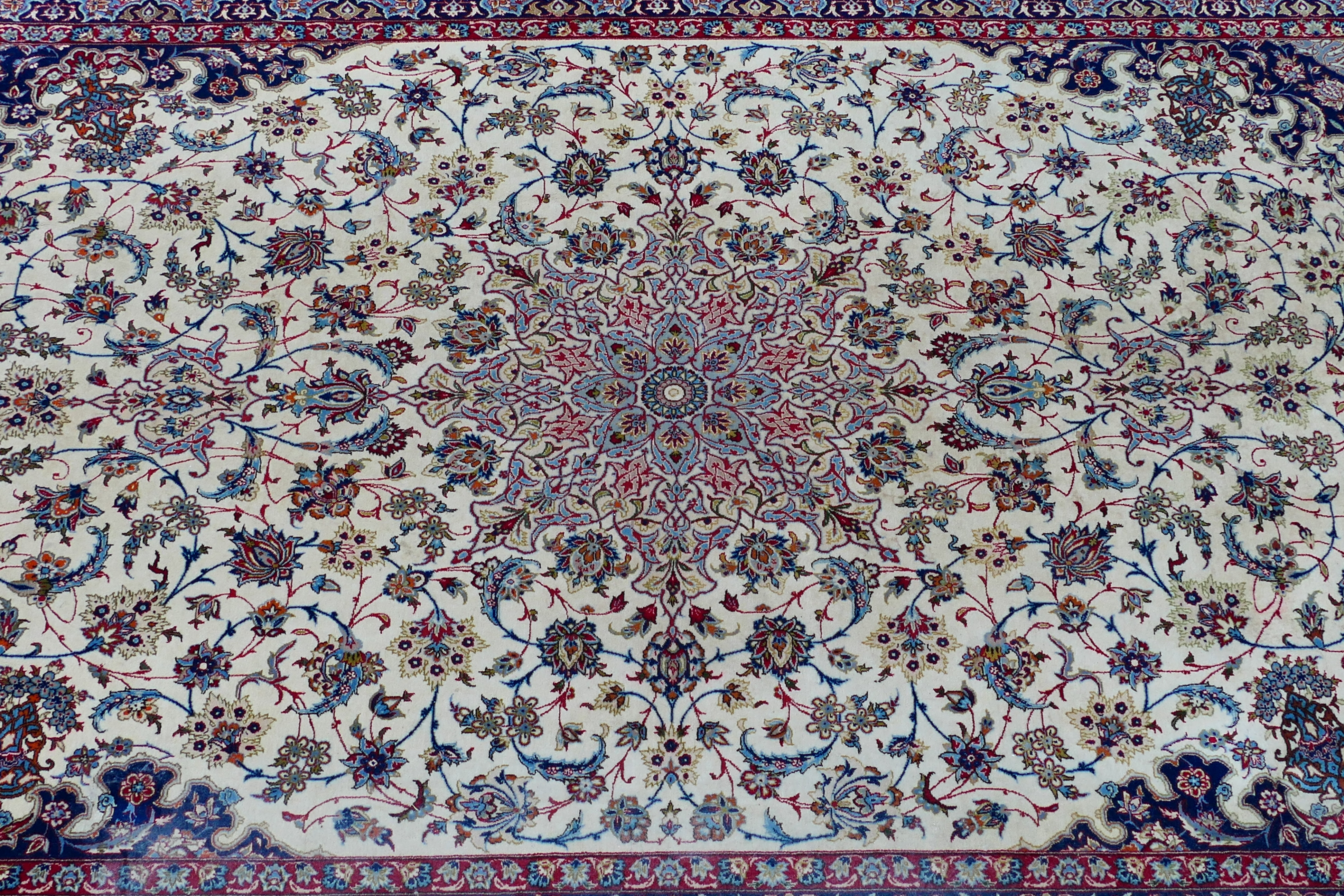 A signed Persian ivory ground rug with central floral medallion, - Image 3 of 7