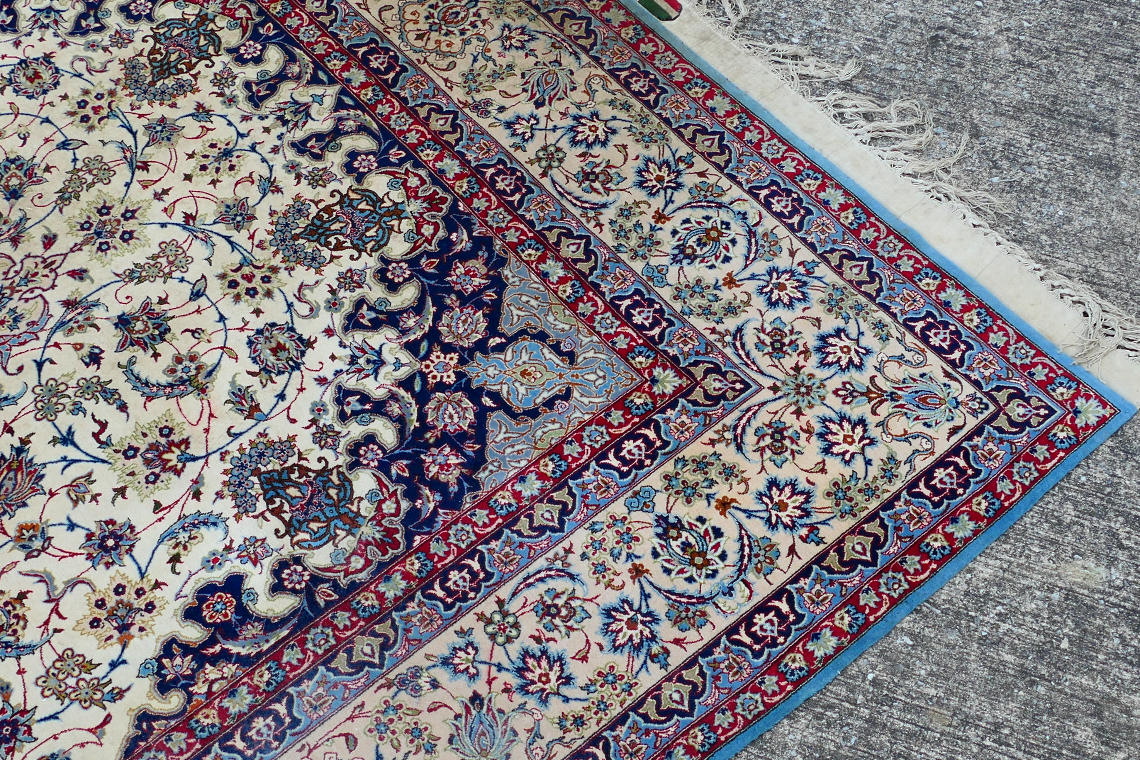 A signed Persian ivory ground rug with central floral medallion, - Image 4 of 7