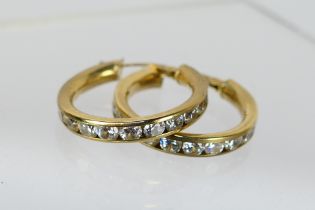A pair of 9ct yellow gold, stone set ear hoops, approximately 3.7 grams.