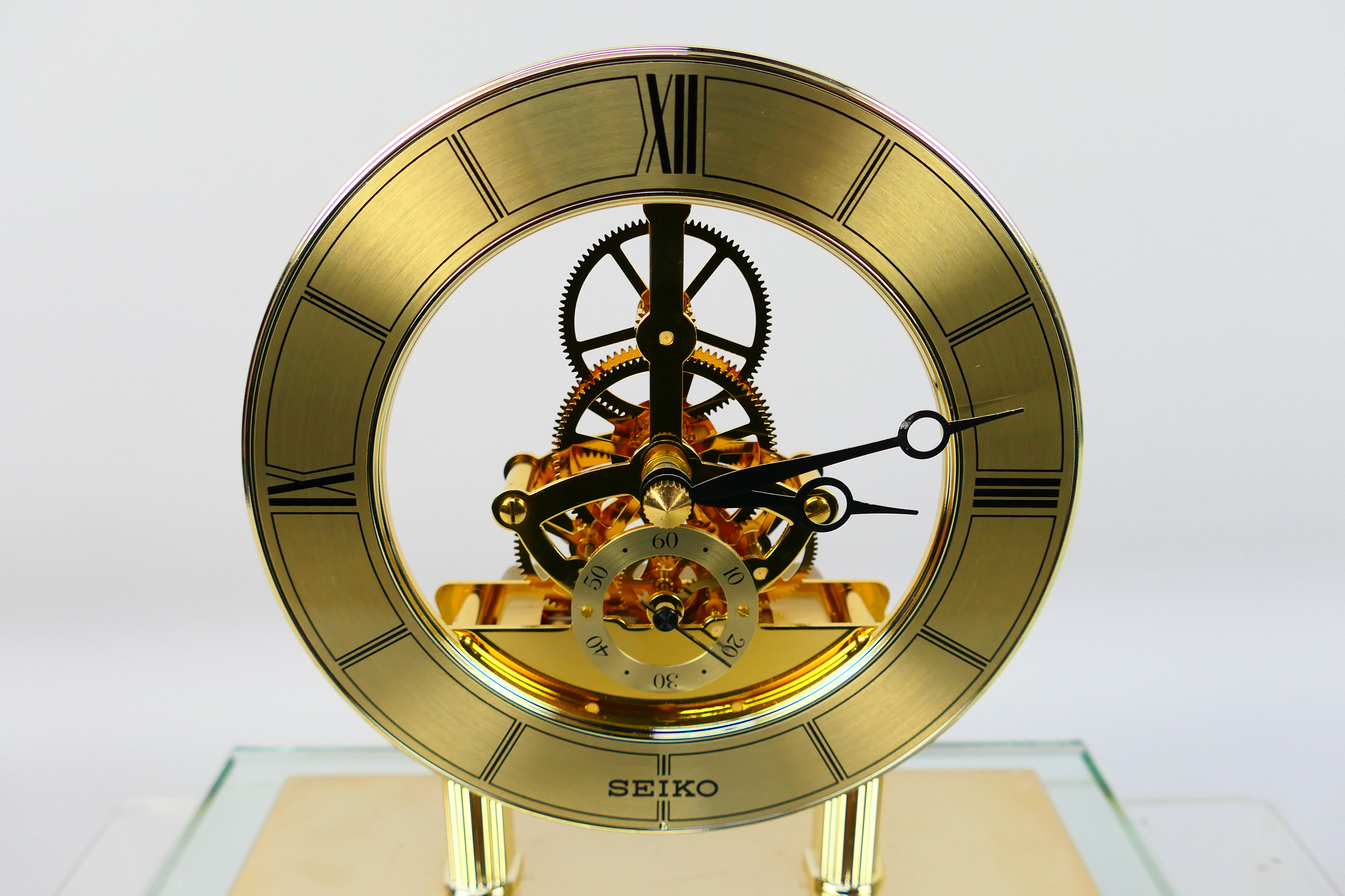 Seiko - A glass cased skeleton clock with quartz movement, 24 cm (h) to top of handle. - Image 5 of 6