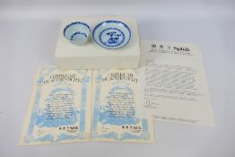 Nanking Cargo - A Qing dynasty blue and white tea bowl and saucer decorated with pine trees, c.