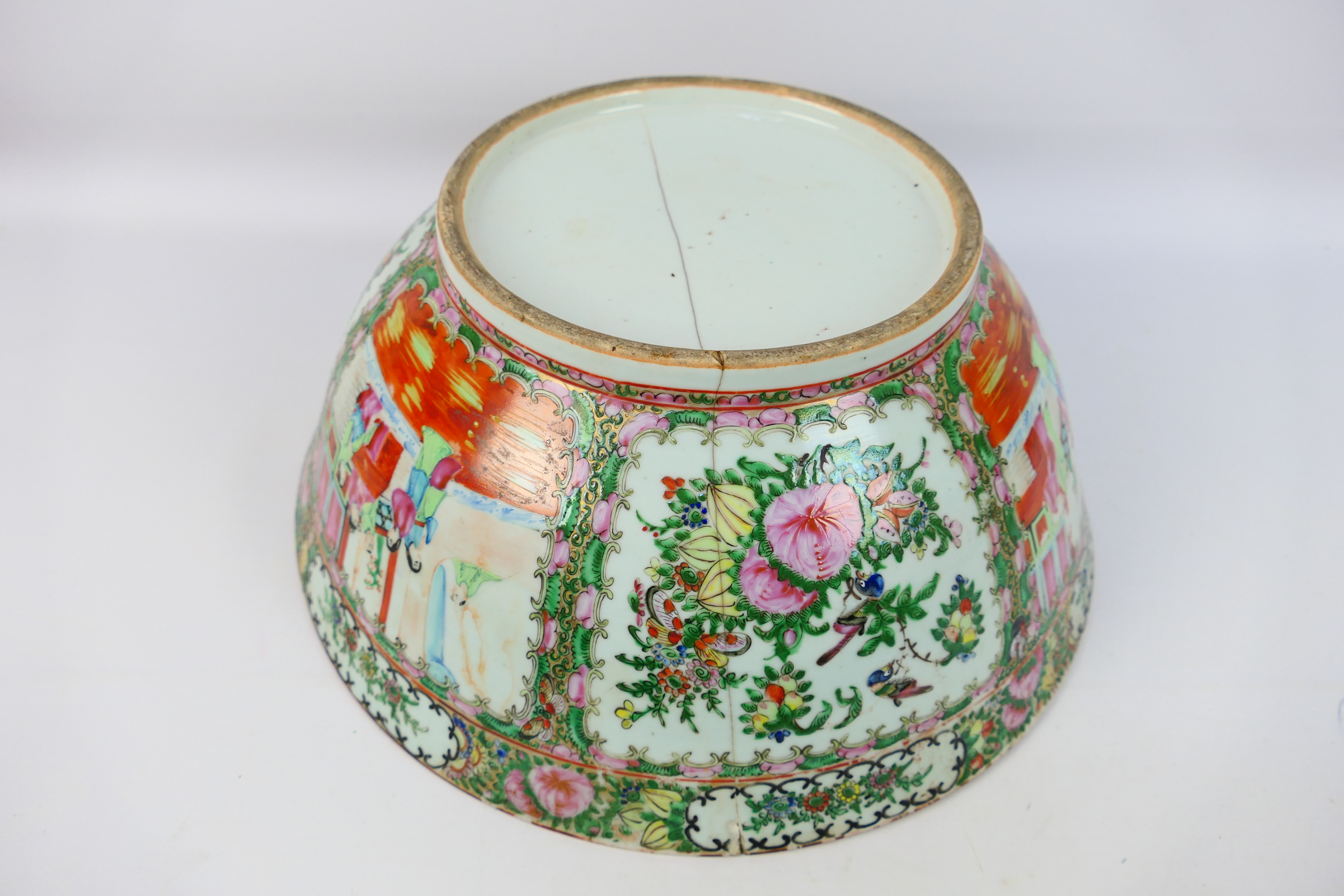 A large Cantonese famille rose punch bowl, typically decorated with panels of figures and flora, - Image 9 of 9
