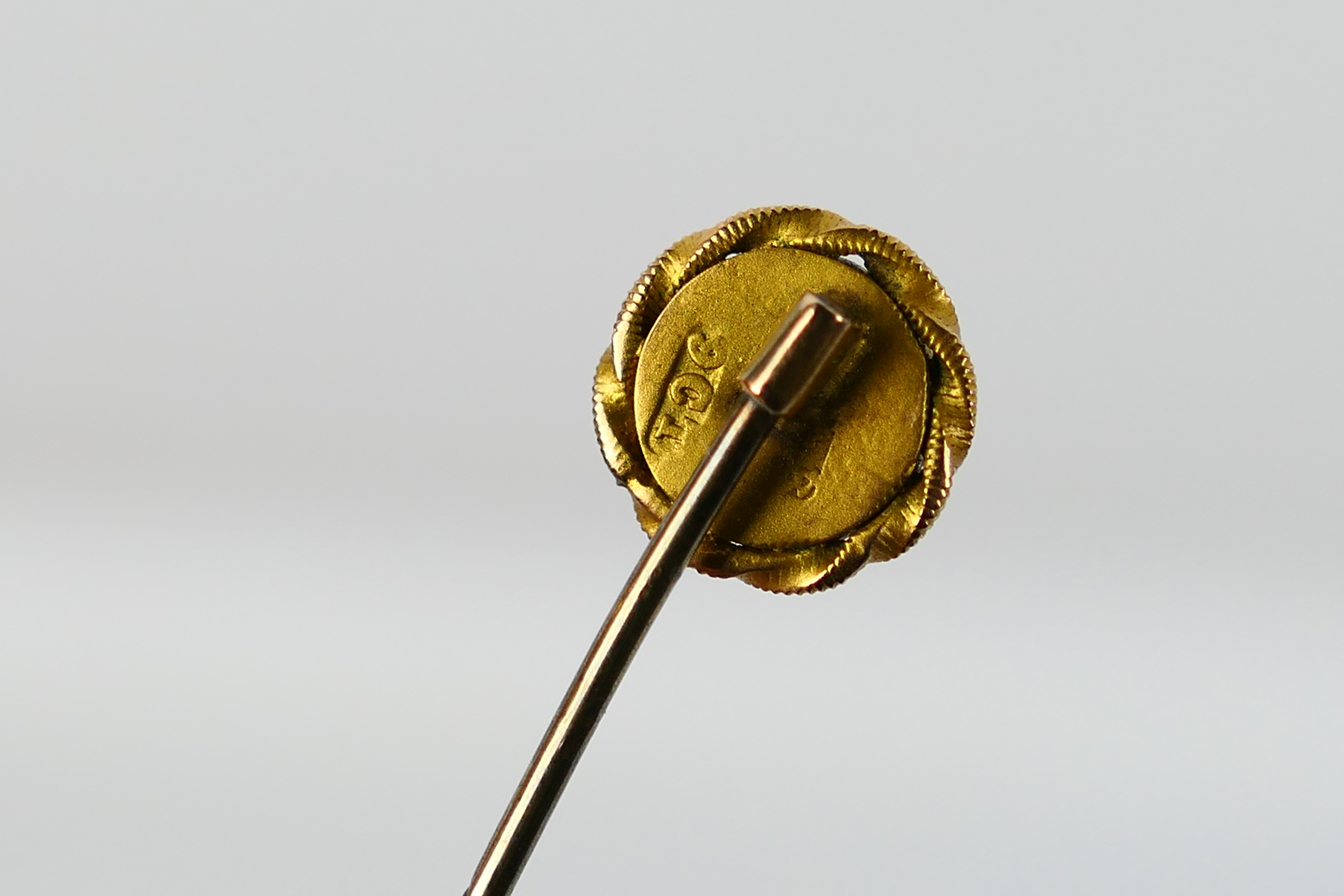 A ruby set stick pin, stamped 9ct, approximately 1.3 grams. - Image 3 of 3