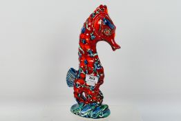An Anita Harris ceramic model of a Seahorse, signed in gold to the base, approximately 29 cm (h).