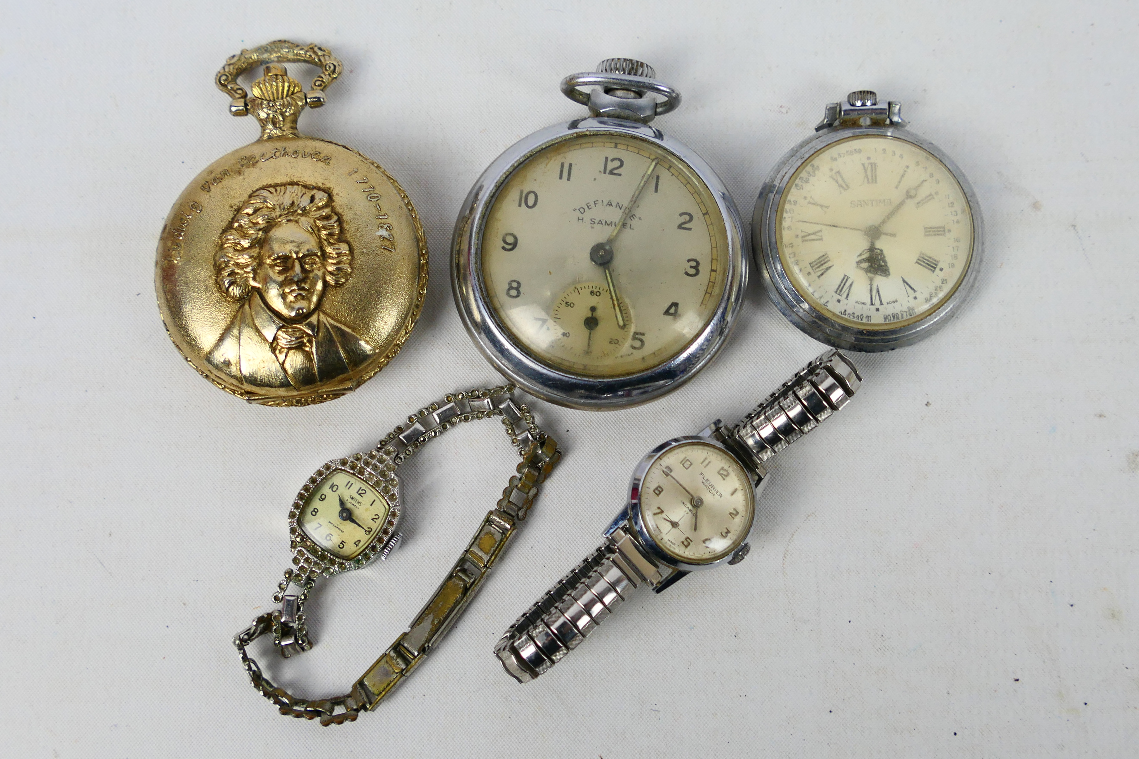 A collection or wrist watches and pocket watches.