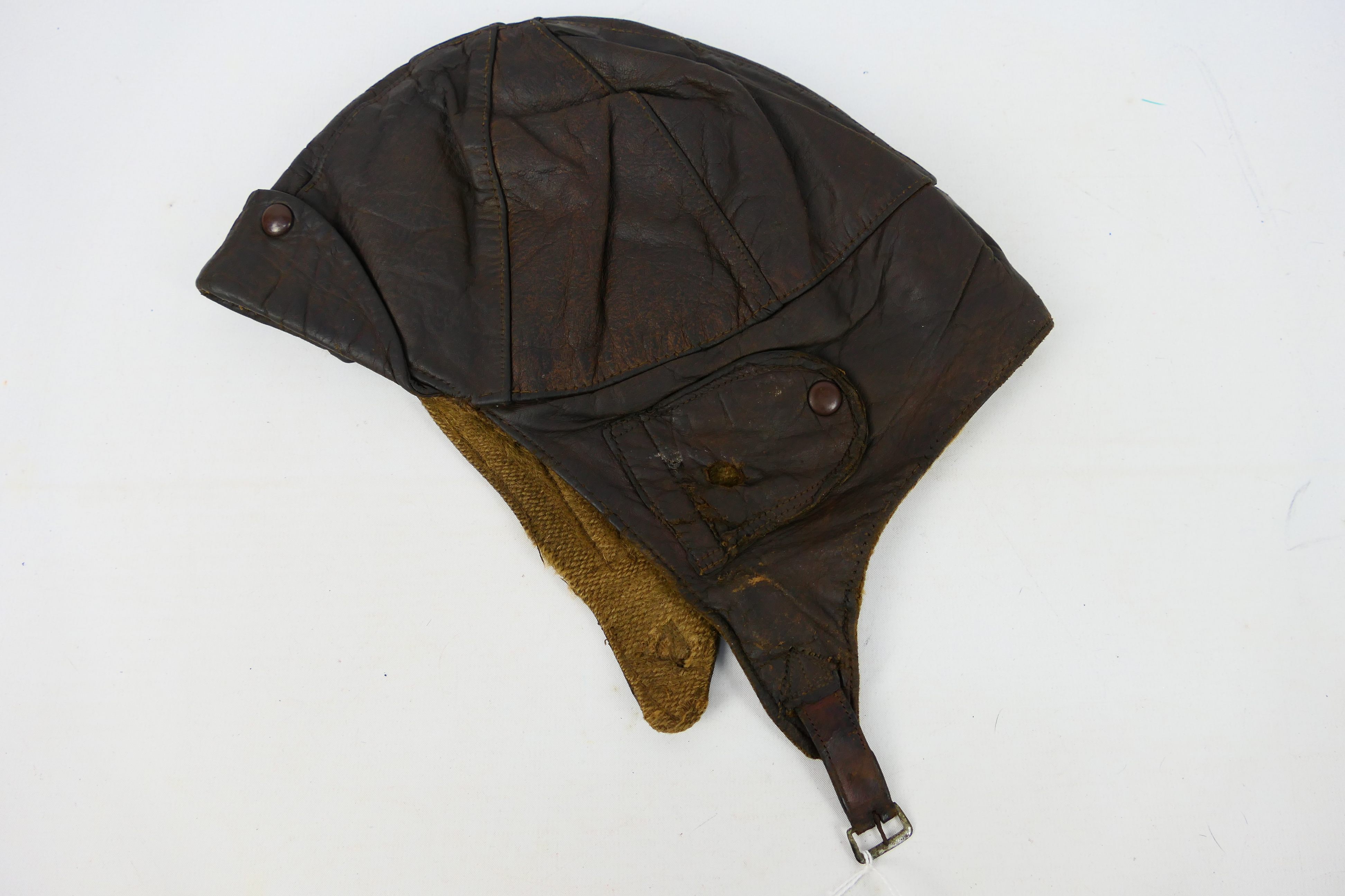 A World War One (WW1 / WWI) period leather flying helmet, RFC Mk1 style in brown leather, unmarked.