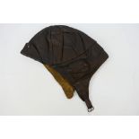A World War One (WW1 / WWI) period leather flying helmet, RFC Mk1 style in brown leather, unmarked.