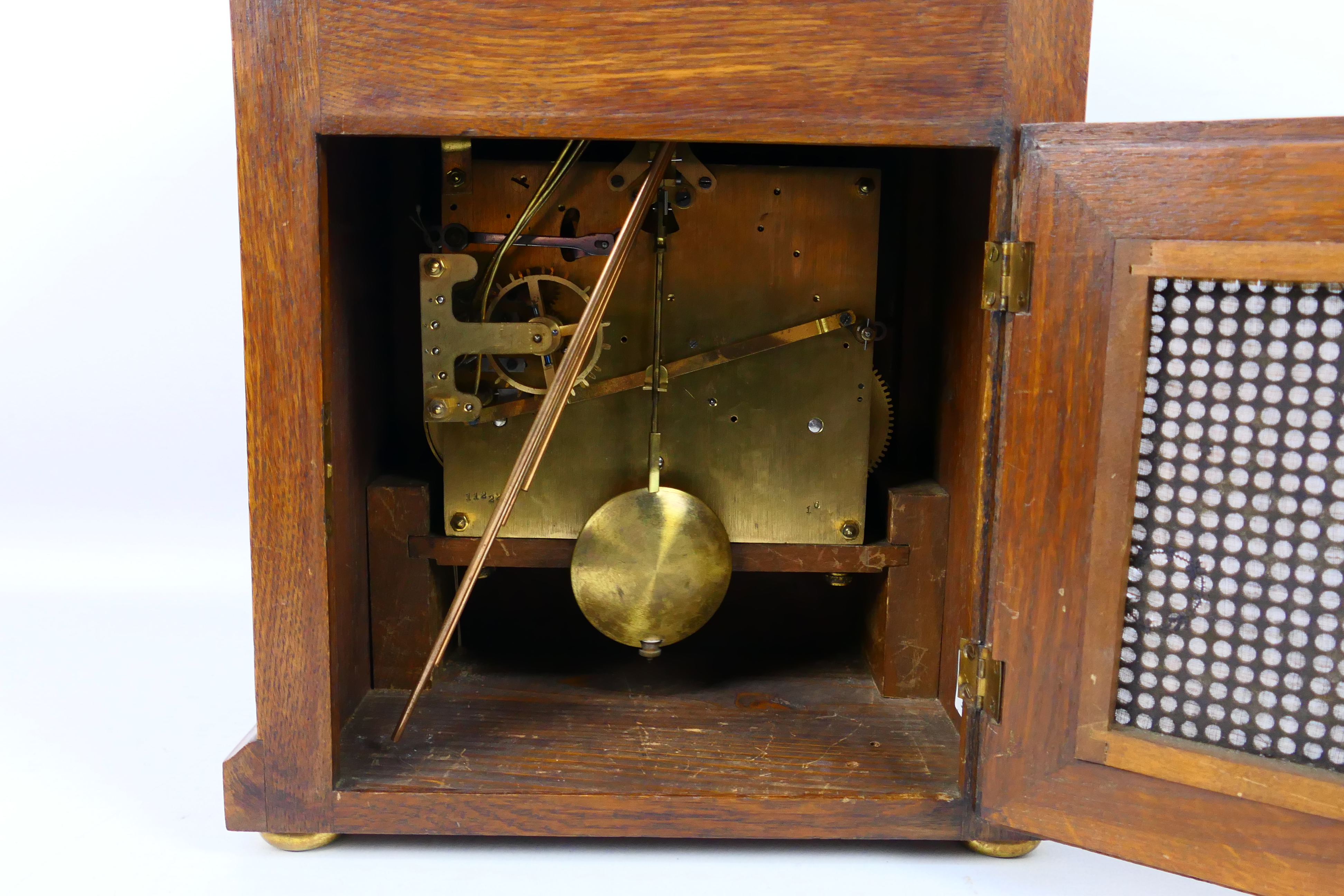 An early 20th century oak cased Westminster chiming mantel clock, the case of a medium oak colour, - Image 8 of 9