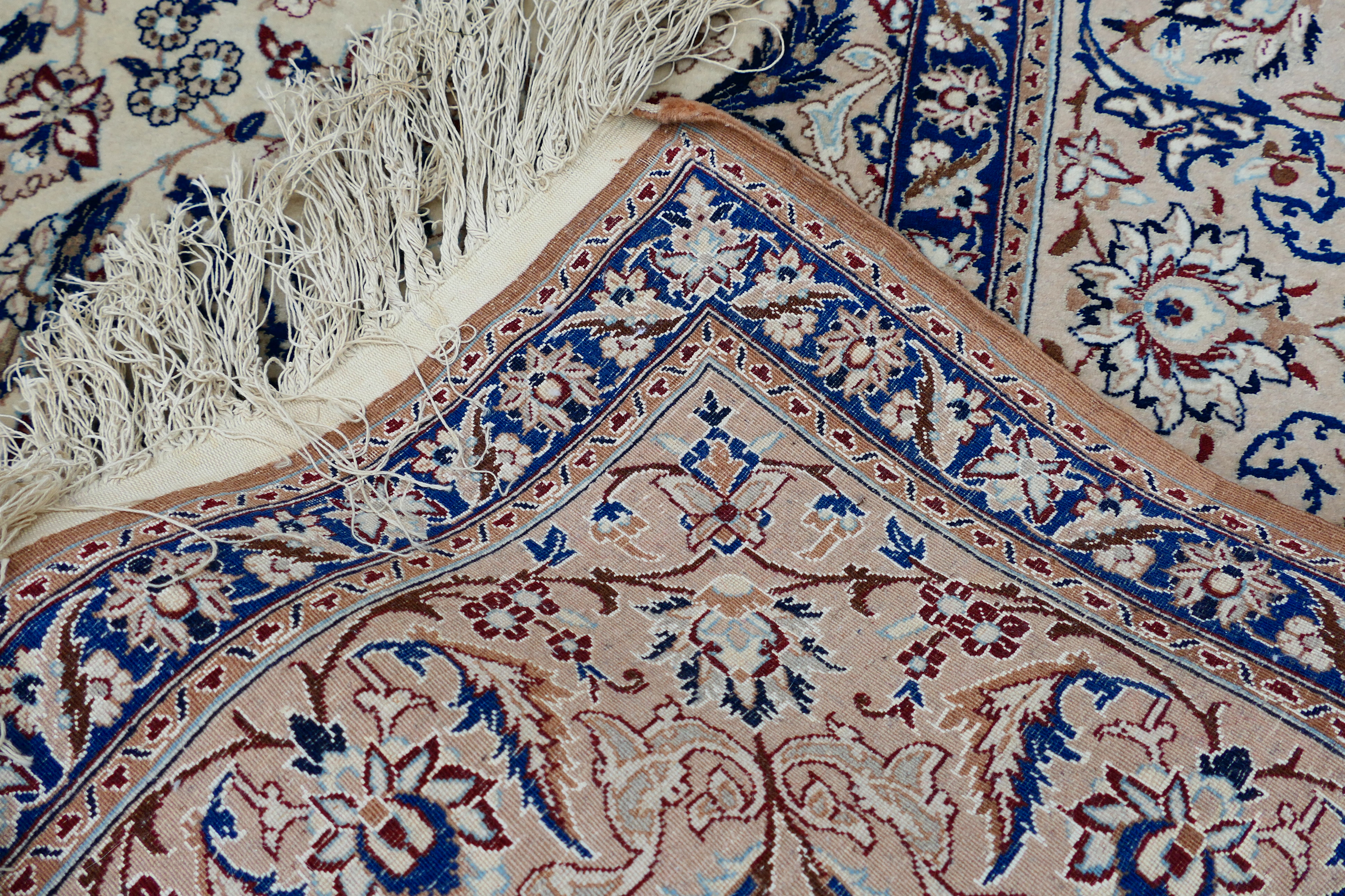 A Persian ivory ground rug with central medallion on a floral field, with foliage scroll border, - Image 8 of 14