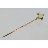 An Edwardian white opal and diamond stick pin contained in fitted case, 1.3 grams.