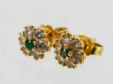 A pair of hallmarked 18ct gold, emerald and diamond ear studs, the butterflies marked 750, 1.