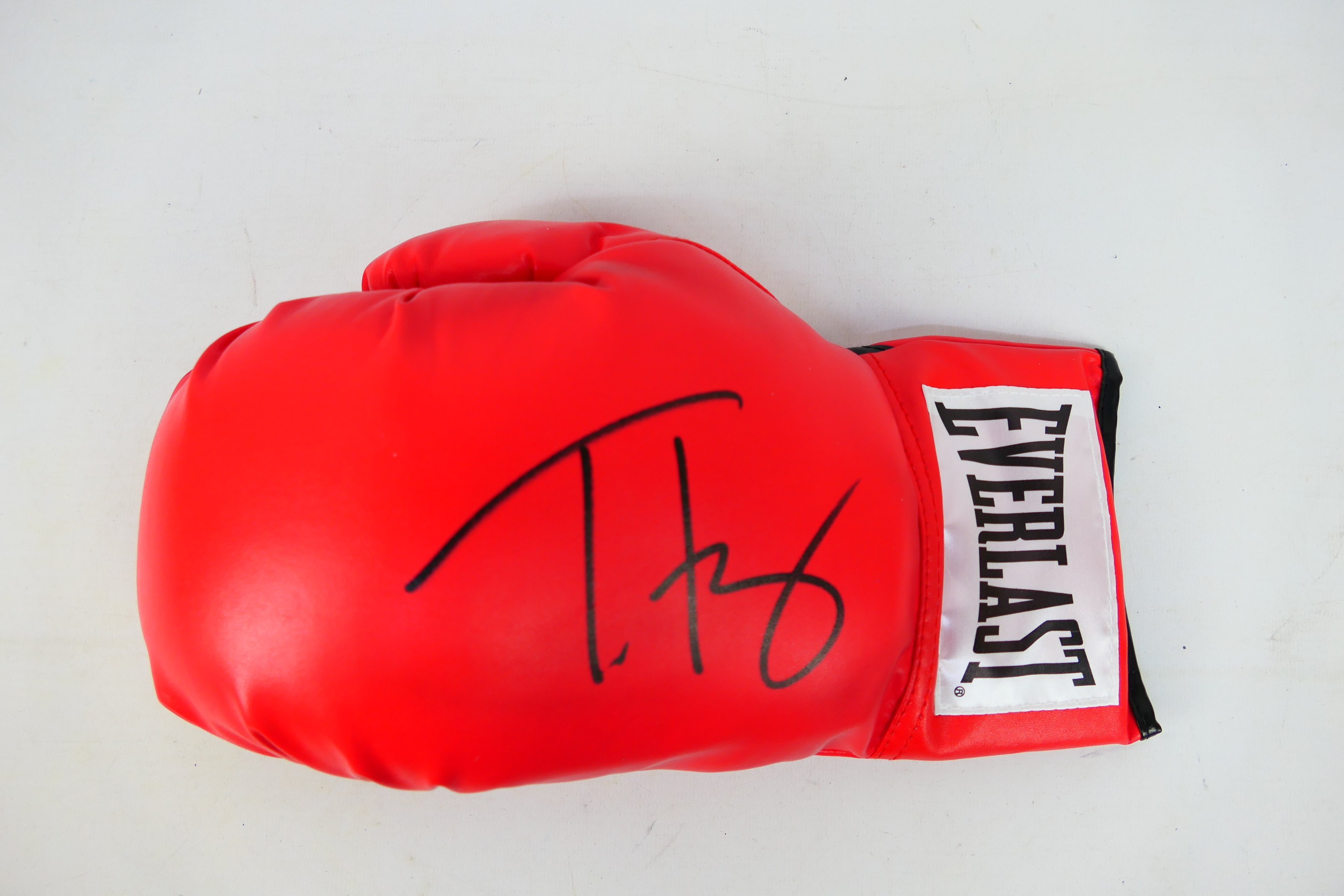 Boxing Interest - A red Everlast boxing glove signed by WBC Heavyweight Champion Tyson Fury,