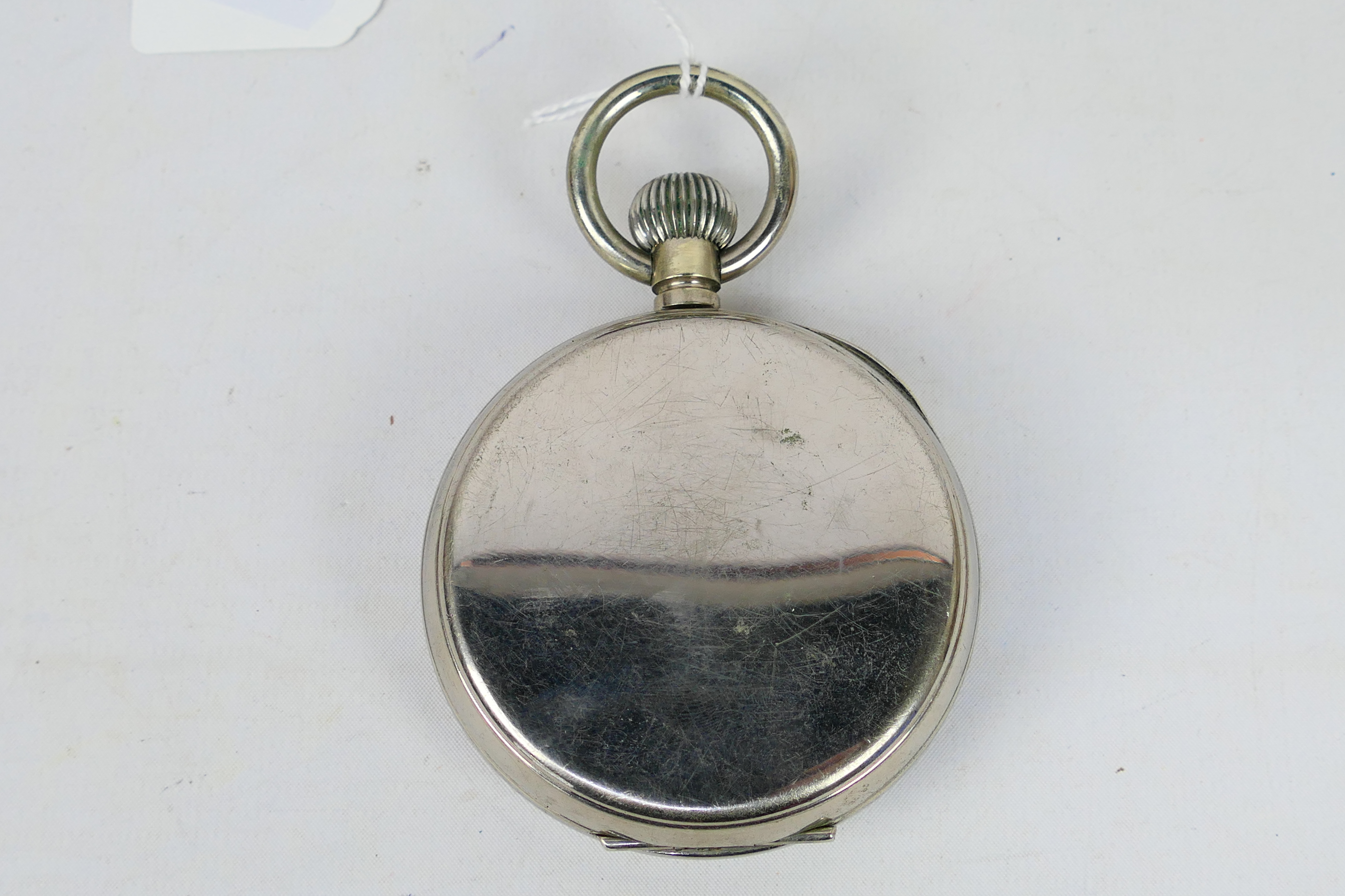 A nickel plated Goliath 8 day pocket watch, Roman numerals to a white enamel dial, - Image 4 of 6