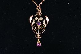 A Victorian rose metal pendant and chain (44 cm length),