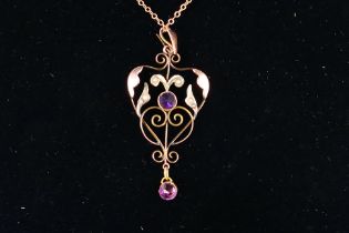 A Victorian rose metal pendant and chain (44 cm length),