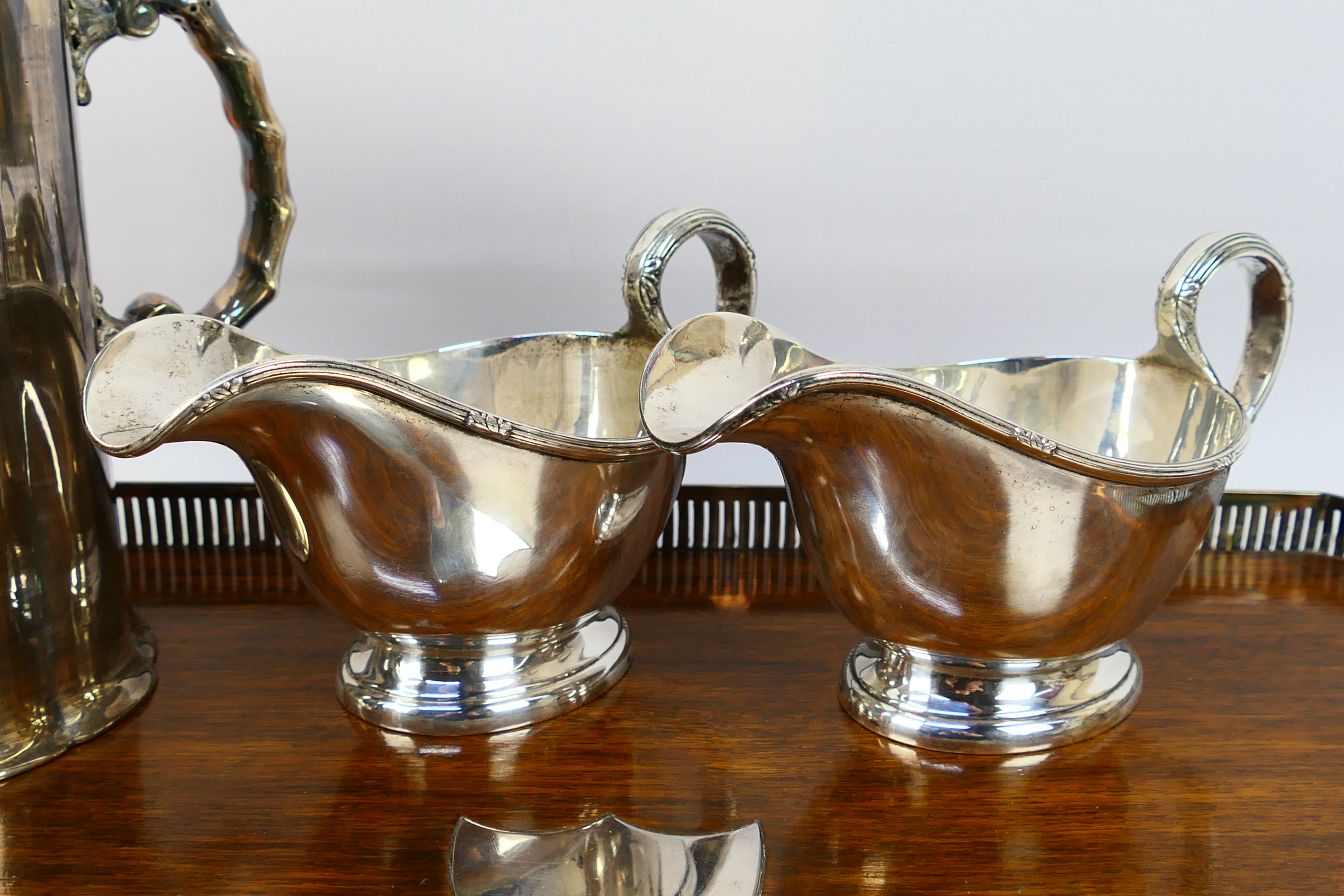 A collection of predominantly silver plated gravy jugs, dish, 2 x jugs, serving tray, - Image 4 of 17