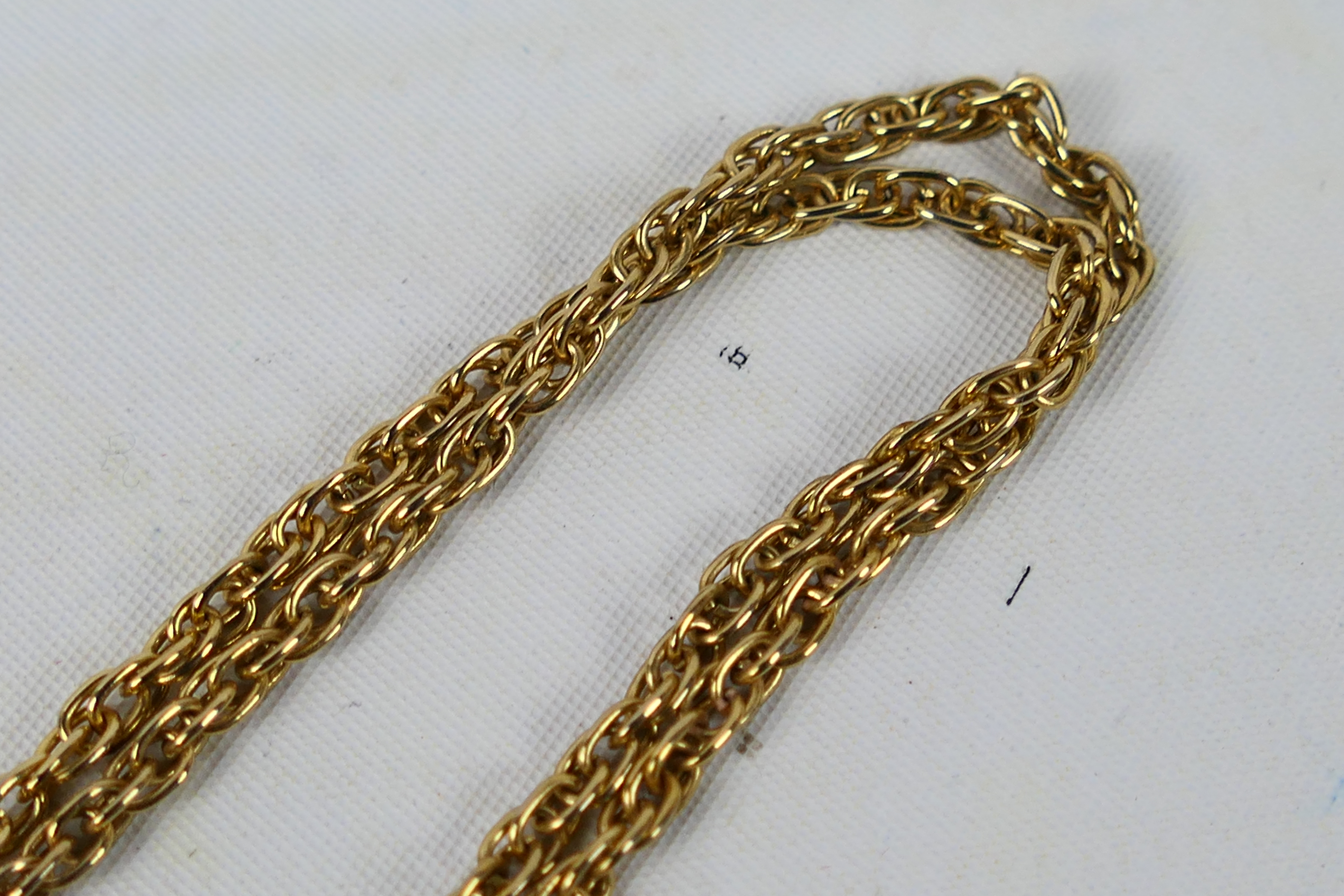 A rose gold ring (hallmarks very rubbed but presumed 9ct) and an unmarked yellow metal chain, - Image 2 of 5