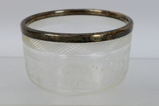 A small crystal glass bowl with sterling silver rim. Makers marked J.G and S. 5 cm (h).