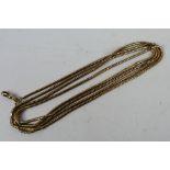 A yellow metal, muff chain and clasp, stamped 9c, 156 cm (l), approximately 44 grams all in.