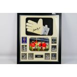 Gordon Banks - A framed display montage comprising a goalkeeper's glove signed by World Cup winner