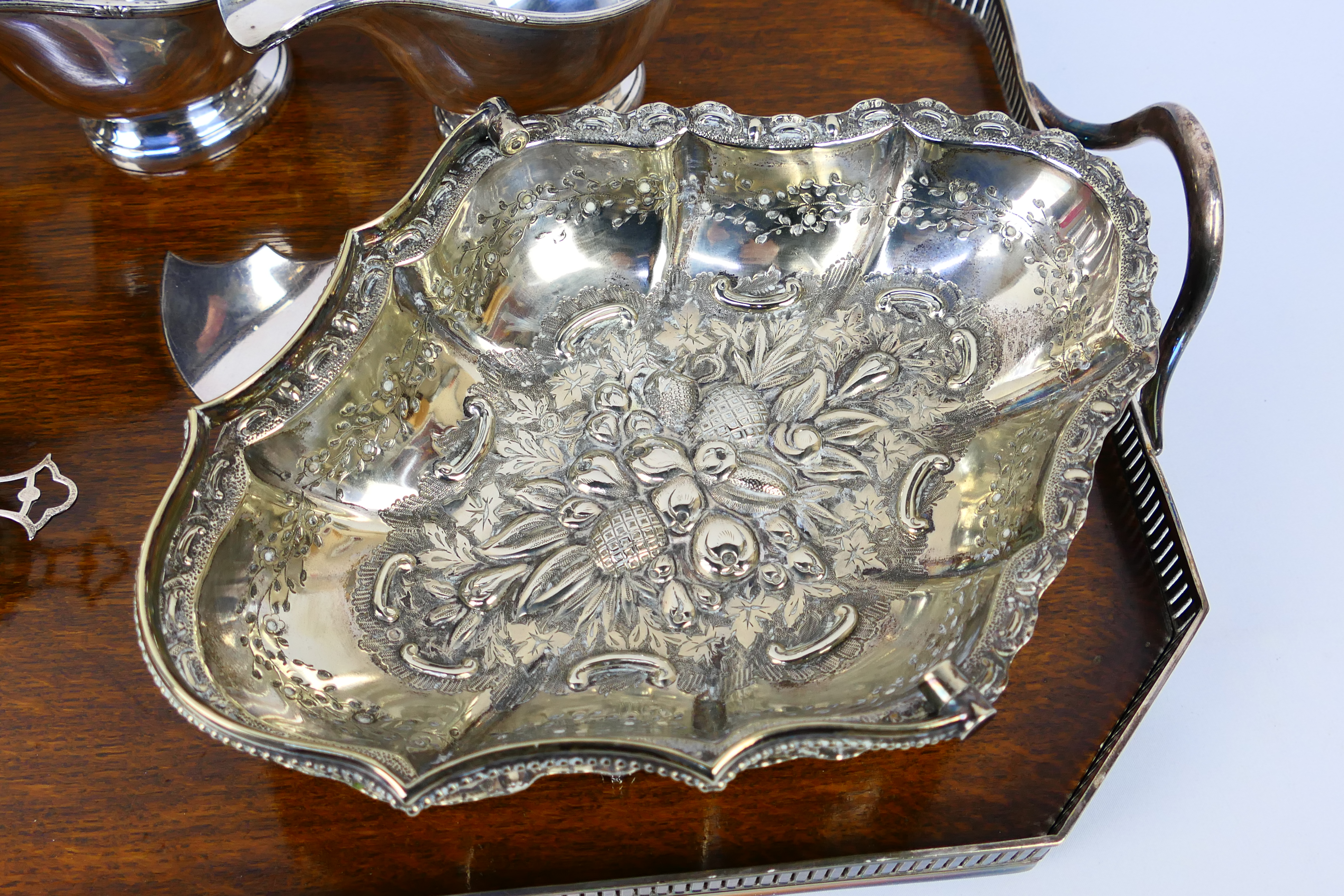 A collection of predominantly silver plated gravy jugs, dish, 2 x jugs, serving tray, - Image 2 of 17