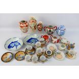 A collection of Asian ceramics to include a pair of blue and white Chinese dishes decorated with