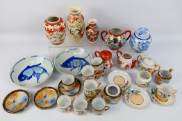 A collection of Asian ceramics to include a pair of blue and white Chinese dishes decorated with