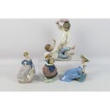 A collection of Lladro and Nao figures / groups, largest approximately 24 cm (h).