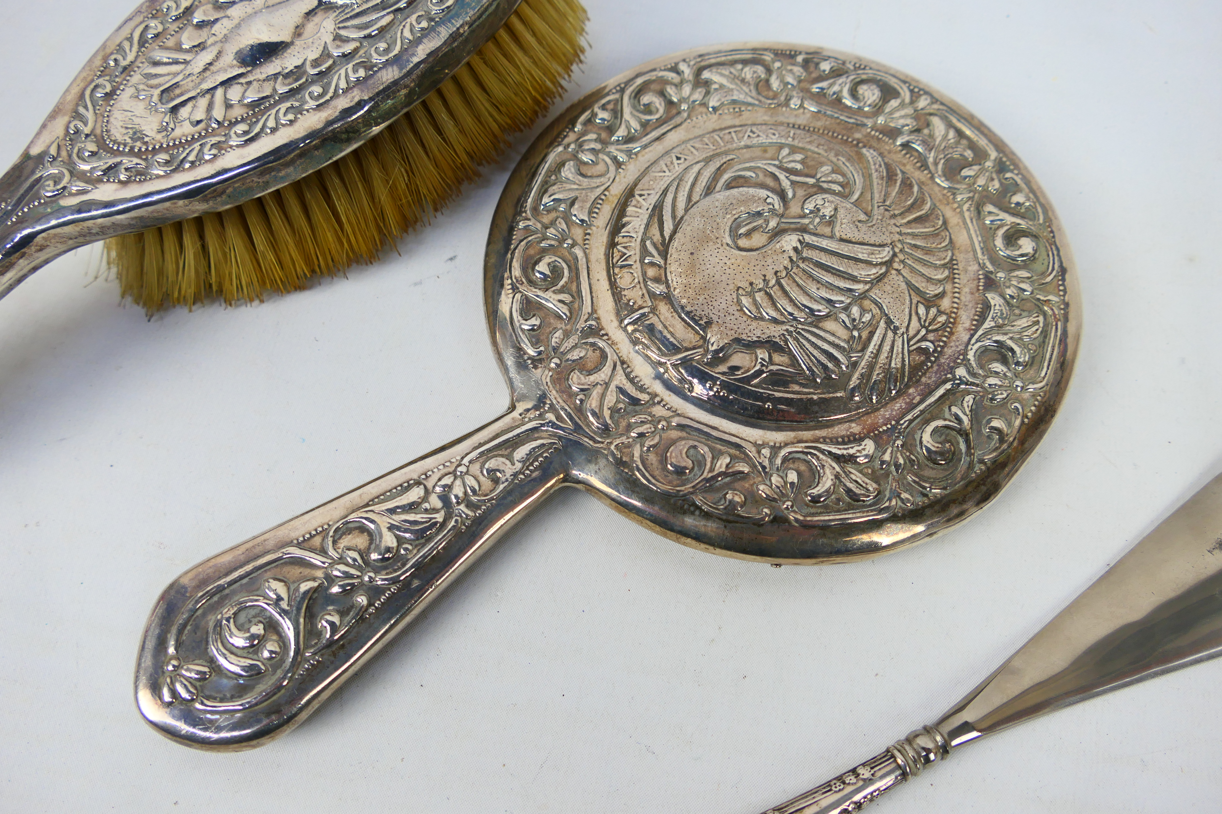 White metal mounted dressing table items comprising a hand mirror and brush with embossed - Image 4 of 8