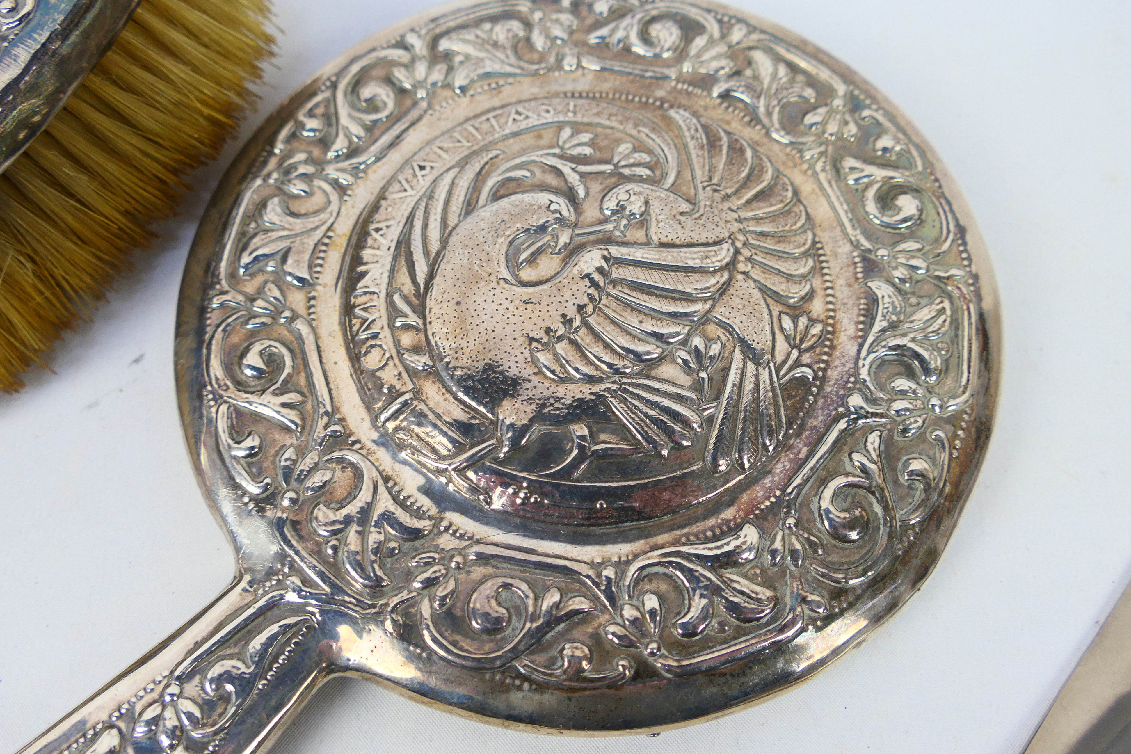 White metal mounted dressing table items comprising a hand mirror and brush with embossed - Image 5 of 8